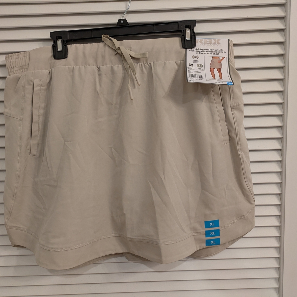 RBX  Stretch Woven Skirt W/Side Pockets And Rounded Tulip Hem & Inner Short